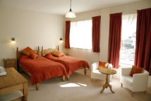 View across a double room inside the The Reading Rooms bed and breakfast in Northumberland